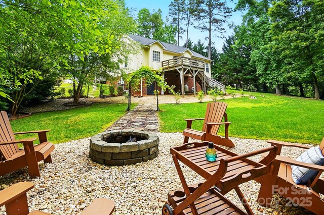 2745 Stockwood Dr, Gastonia, NC 28056 - view of patio / terrace featuring an outdoor fire pit, stairway, and a wooden deck
