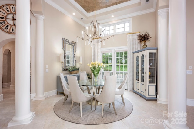 140 Lightship Dr, Mooresville, NC 28117 - dining space featuring a high ceiling, ornate columns, crown molding, light tile patterned floors, and baseboards