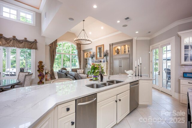 140 Lightship Dr, Mooresville, NC 28117 - kitchen with a sink, dishwasher, glass insert cabinets, light stone countertops, and white cabinets