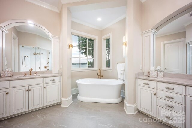140 Lightship Dr, Mooresville, NC 28117 - bathroom featuring ornamental molding, a soaking tub, vanity, marble finish flooring, and baseboards