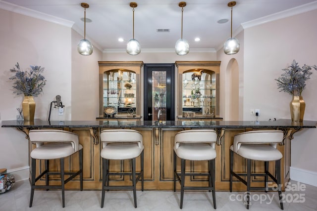140 Lightship Dr, Mooresville, NC 28117 - indoor wet bar with ornamental molding, decorative light fixtures, and baseboards