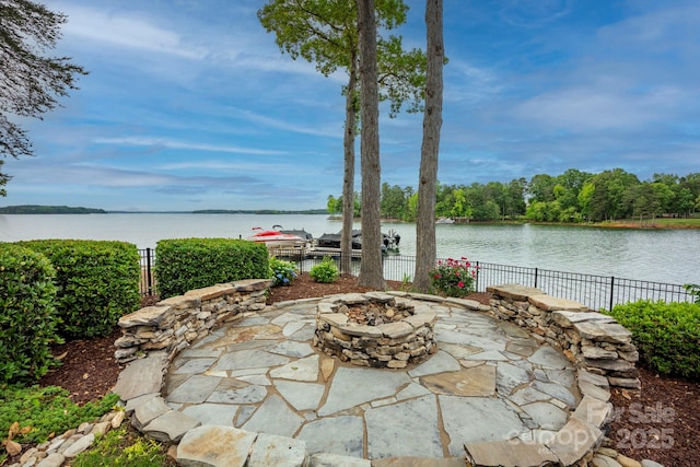 140 Lightship Dr, Mooresville, NC 28117 - view of patio / terrace featuring a fire pit, fence, and a water view