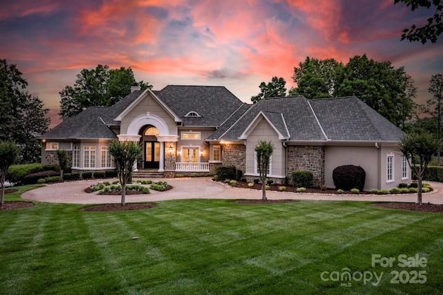 140 Lightship Dr, Mooresville, NC 28117 - french provincial home featuring stone siding, french doors, a yard, a chimney, and stucco siding