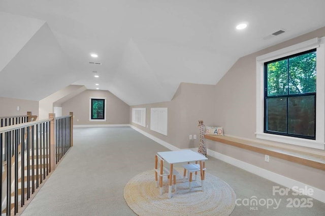 bonus room featuring carpet floors, baseboards, and lofted ceiling