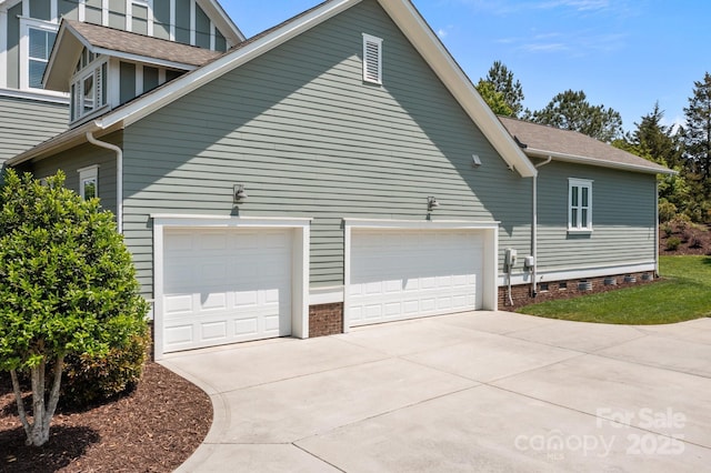 10822 Brandie Meadow Ln, Huntersville, NC 28078 - view of property exterior featuring driveway, a garage, a shingled roof, and crawl space