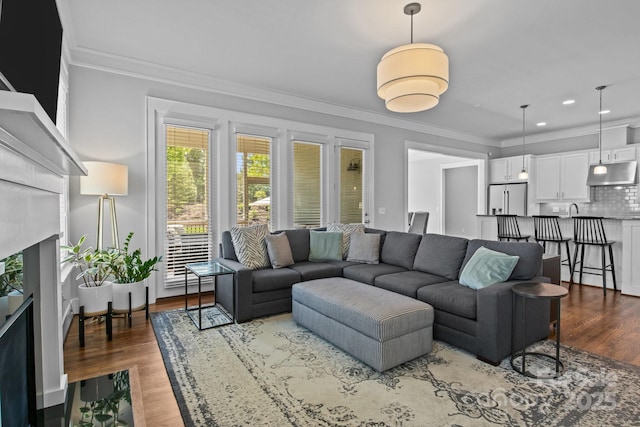 10822 Brandie Meadow Ln, Huntersville, NC 28078 - living area with crown molding, wood finished floors, recessed lighting, and a premium fireplace