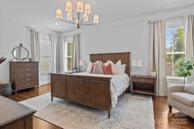 10822 Brandie Meadow Ln, Huntersville, NC 28078 - bedroom with a chandelier, crown molding, wood finished floors, and recessed lighting