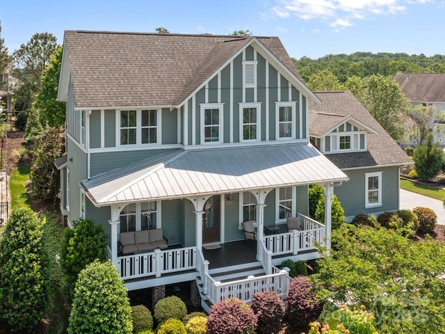 10822 Brandie Meadow Ln, Huntersville, NC 28078 - view of front of home with covered porch, a shingled roof, metal roof, and board and batten siding