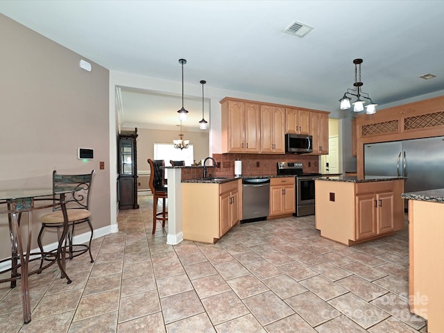 kitchen featuring an inviting chandelier, visible vents, light brown cabinets, a sink, and appliances with stainless steel finishes