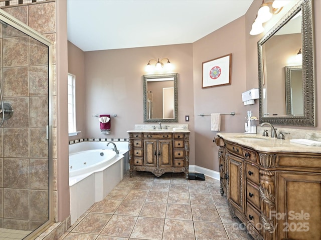 full bath with a jetted tub, tile patterned flooring, a shower stall, two vanities, and a sink