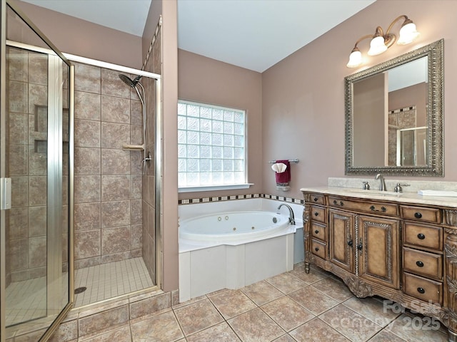 full bathroom featuring a whirlpool tub, tile patterned flooring, vanity, and a shower stall
