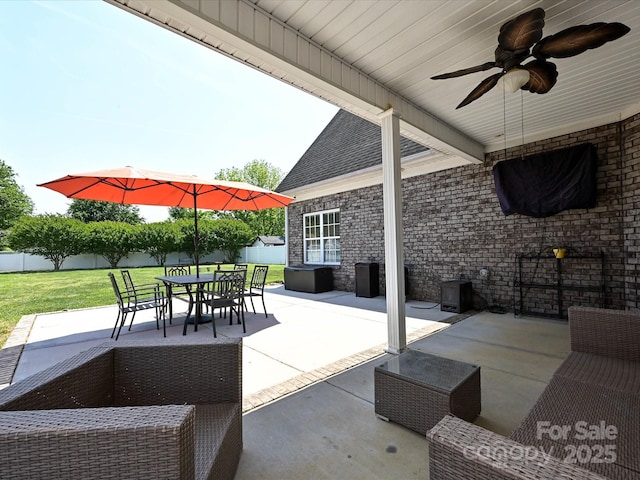 view of patio / terrace with a fenced backyard, outdoor dining space, and ceiling fan