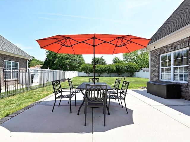 view of patio / terrace with central air condition unit, outdoor dining area, and a fenced backyard