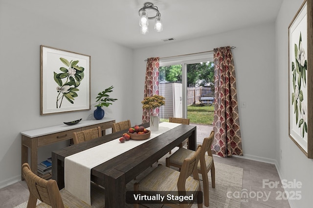dining area featuring baseboards