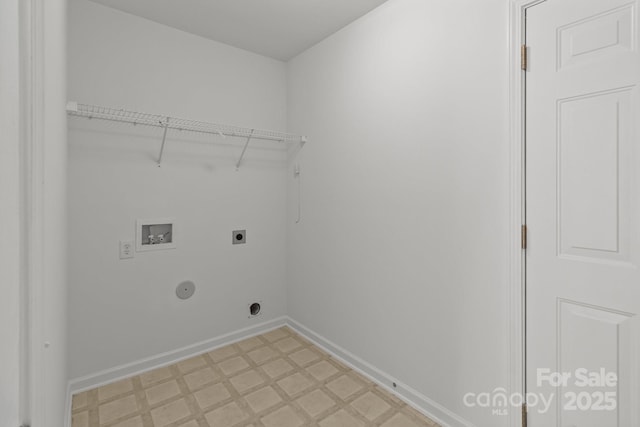 clothes washing area featuring hookup for an electric dryer, hookup for a washing machine, light flooring, and baseboards