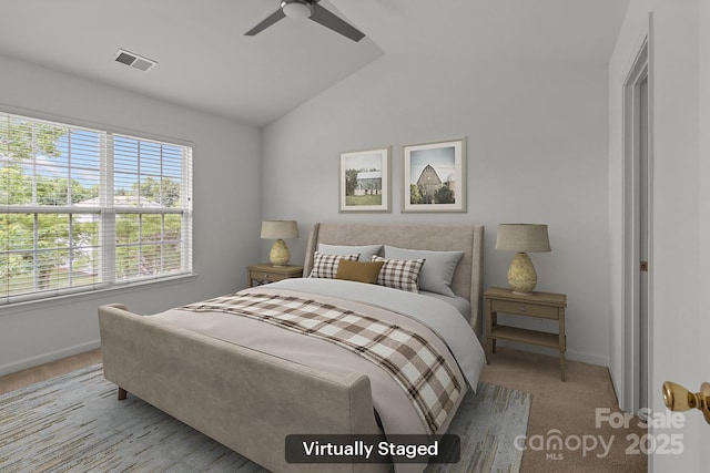 bedroom featuring lofted ceiling, baseboards, and a ceiling fan