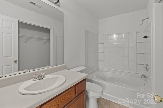 full bathroom featuring toilet, shower / washtub combination, vanity, and tile patterned floors