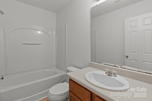 full bathroom featuring toilet, vanity, and bathing tub / shower combination