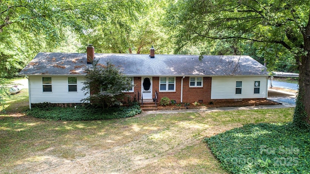 3933 Planters Pl, Indian Trail, NC 28079 - ranch-style home featuring a chimney, a shingled roof, a front yard, and brick siding
