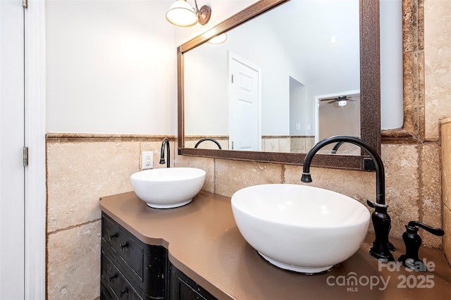 3933 Planters Pl, Indian Trail, NC 28079 - bathroom with tile walls, double vanity, and a wainscoted wall