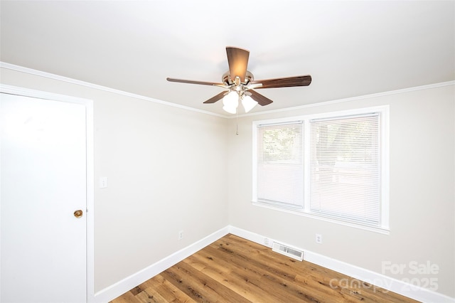 3933 Planters Pl, Indian Trail, NC 28079 - empty room with ceiling fan, light wood finished floors, and crown molding