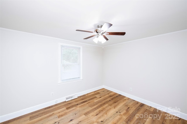 3933 Planters Pl, Indian Trail, NC 28079 - spare room with a ceiling fan, wood finished floors, and crown molding