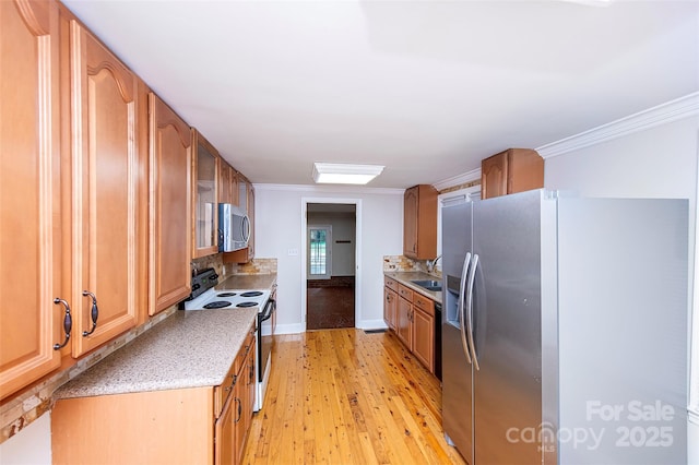 3933 Planters Pl, Indian Trail, NC 28079 - kitchen featuring stainless steel appliances, light wood-style floors, crown molding, backsplash, and glass insert cabinets