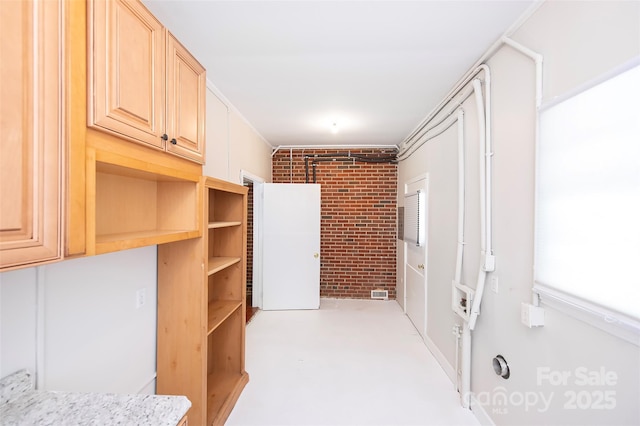 3933 Planters Pl, Indian Trail, NC 28079 - interior space with brick wall and finished concrete flooring