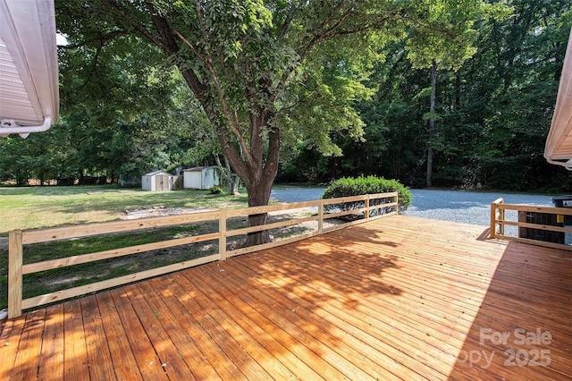 3933 Planters Pl, Indian Trail, NC 28079 - wooden terrace with a storage shed, a water view, and view of wooded area