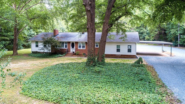 3933 Planters Pl, Indian Trail, NC 28079 - ranch-style home with driveway, a chimney, a carport, a front yard, and brick siding