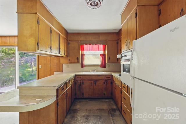 3120 Mineral Springs Mountain Rd, Valdese, NC 28690 - kitchen featuring freestanding refrigerator, light countertops, a sink, a peninsula, and healthy amount of natural light