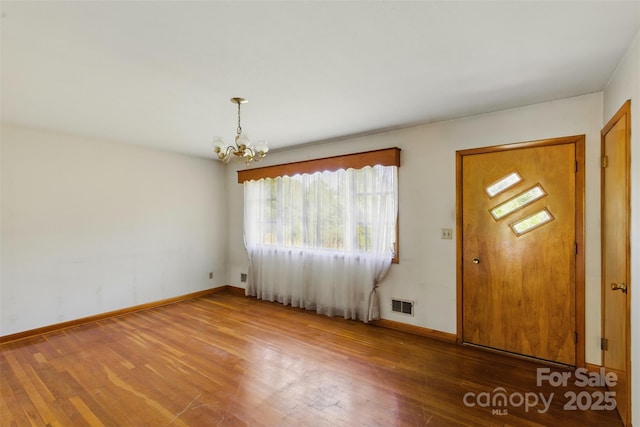 3120 Mineral Springs Mountain Rd, Valdese, NC 28690 - foyer entrance featuring hardwood / wood-style flooring, a chandelier, and baseboards