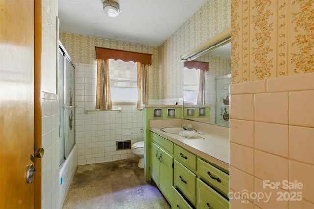 3120 Mineral Springs Mountain Rd, Valdese, NC 28690 - full bathroom with wallpapered walls, tile walls, wainscoting, vanity, and toilet