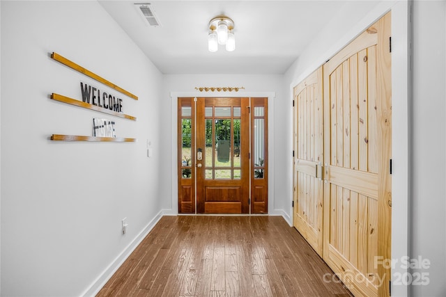 5615 American Way, Denver, NC 28037 - entryway featuring baseboards, hardwood / wood-style floors, and visible vents