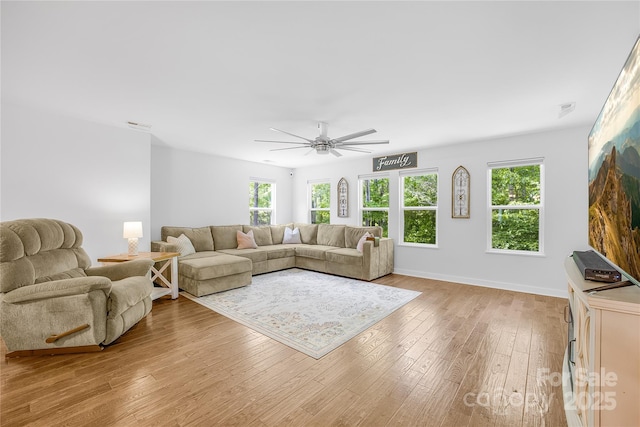 5615 American Way, Denver, NC 28037 - living area with baseboards, a ceiling fan, light wood-style flooring, and visible vents