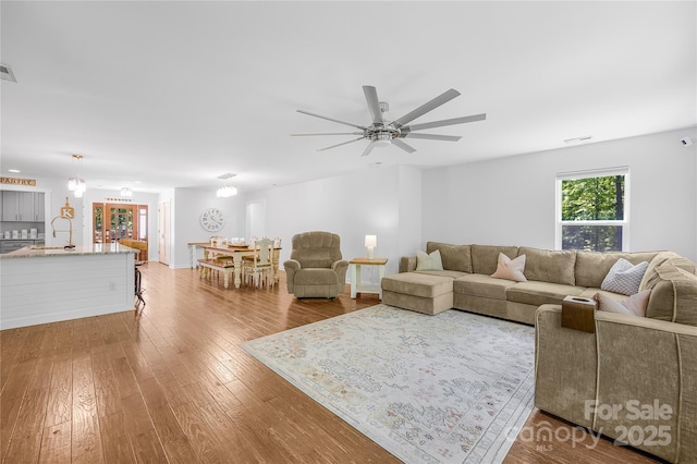 5615 American Way, Denver, NC 28037 - living area featuring a ceiling fan, wood finished floors, and visible vents