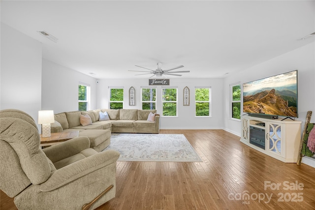 5615 American Way, Denver, NC 28037 - living room featuring visible vents, baseboards, ceiling fan, and wood finished floors