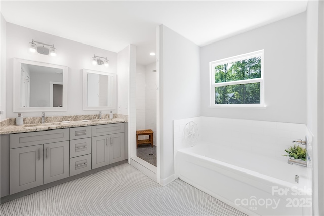 5615 American Way, Denver, NC 28037 - bathroom featuring double vanity, a tile shower, a sink, and a garden tub