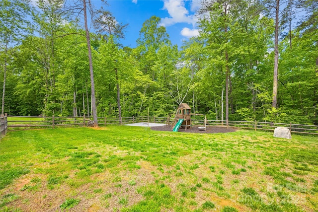 5615 American Way, Denver, NC 28037 - view of yard with a fenced backyard, a playground, and a forest view