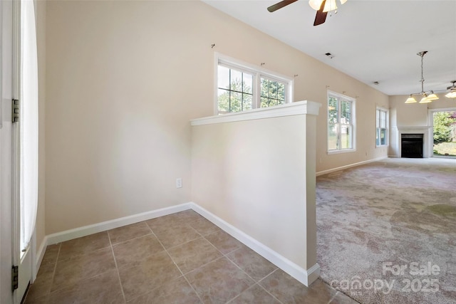8 Cherry Laurel Ln, Swannanoa, NC 28778 - unfurnished living room featuring baseboards, a ceiling fan, a fireplace, and tile patterned floors