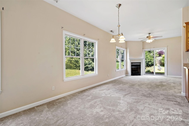 8 Cherry Laurel Ln, Swannanoa, NC 28778 - unfurnished living room with carpet floors, baseboards, a ceiling fan, and a fireplace