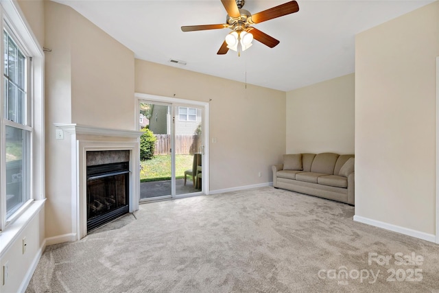 8 Cherry Laurel Ln, Swannanoa, NC 28778 - unfurnished living room with carpet, baseboards, ceiling fan, and a fireplace with flush hearth