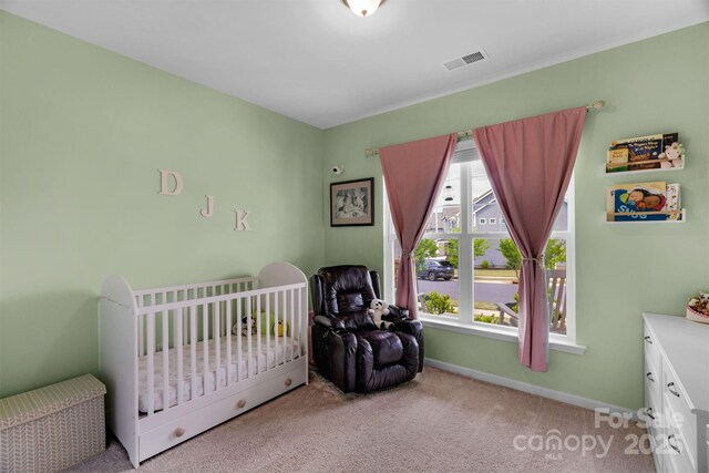 bedroom with carpet flooring, baseboards, and visible vents