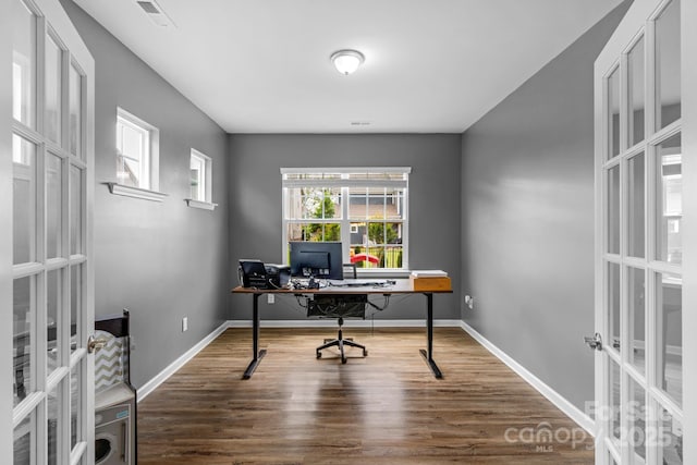 office area featuring baseboards, french doors, visible vents, and wood finished floors
