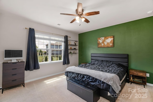 carpeted bedroom with baseboards and ceiling fan
