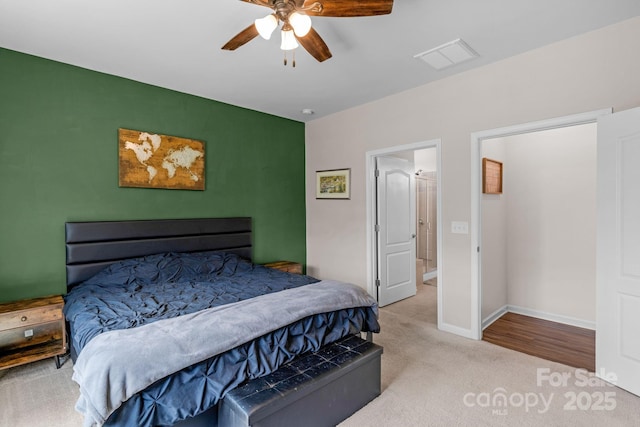 carpeted bedroom with baseboards, ceiling fan, and visible vents