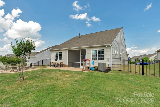 back of house with a lawn, a patio area, central AC, and fence private yard
