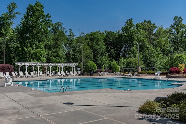 4040 Deep River Way, Waxhaw, NC 28173 - community pool with a patio area and view of wooded area