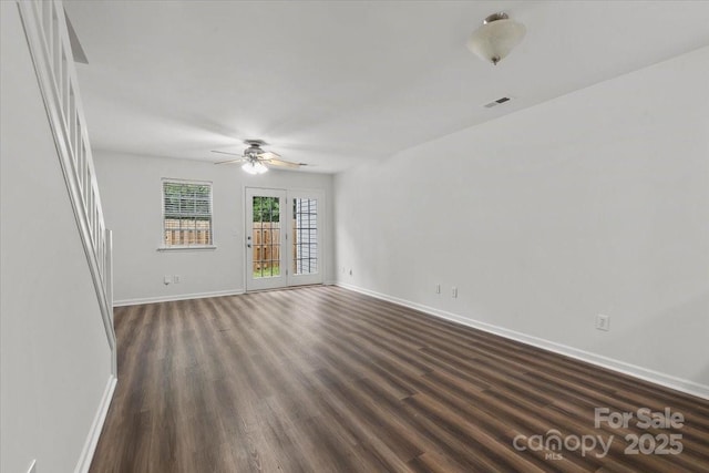 13660 Meade Glen Ct, Charlotte, NC 28273 - unfurnished room featuring baseboards, a ceiling fan, and dark wood finished floors
