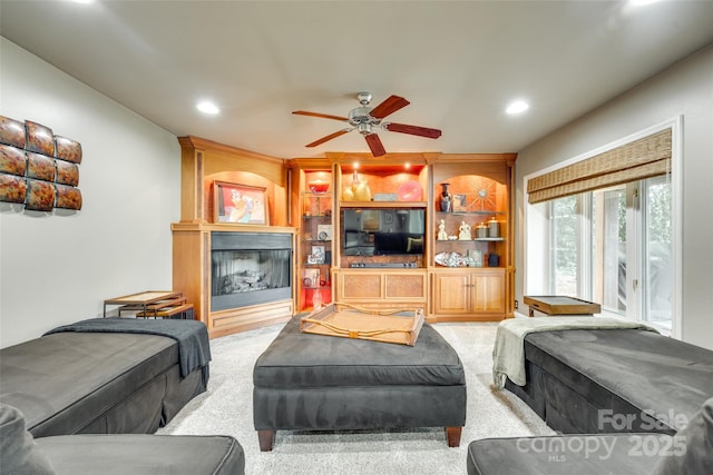 16317 Terry Ln, Huntersville, NC 28078 - carpeted living room with recessed lighting, a ceiling fan, and a large fireplace
